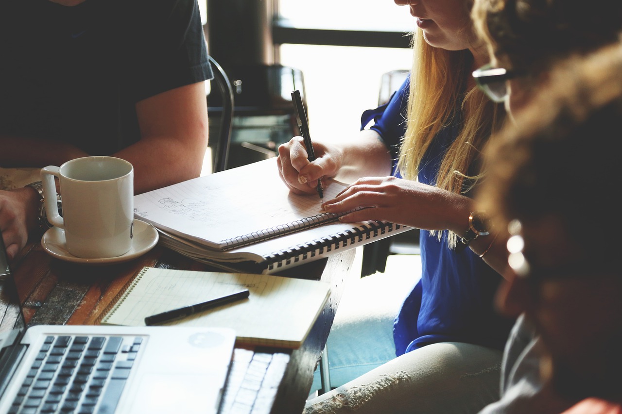 Business owners signing an LLC operating agreement to protect their company